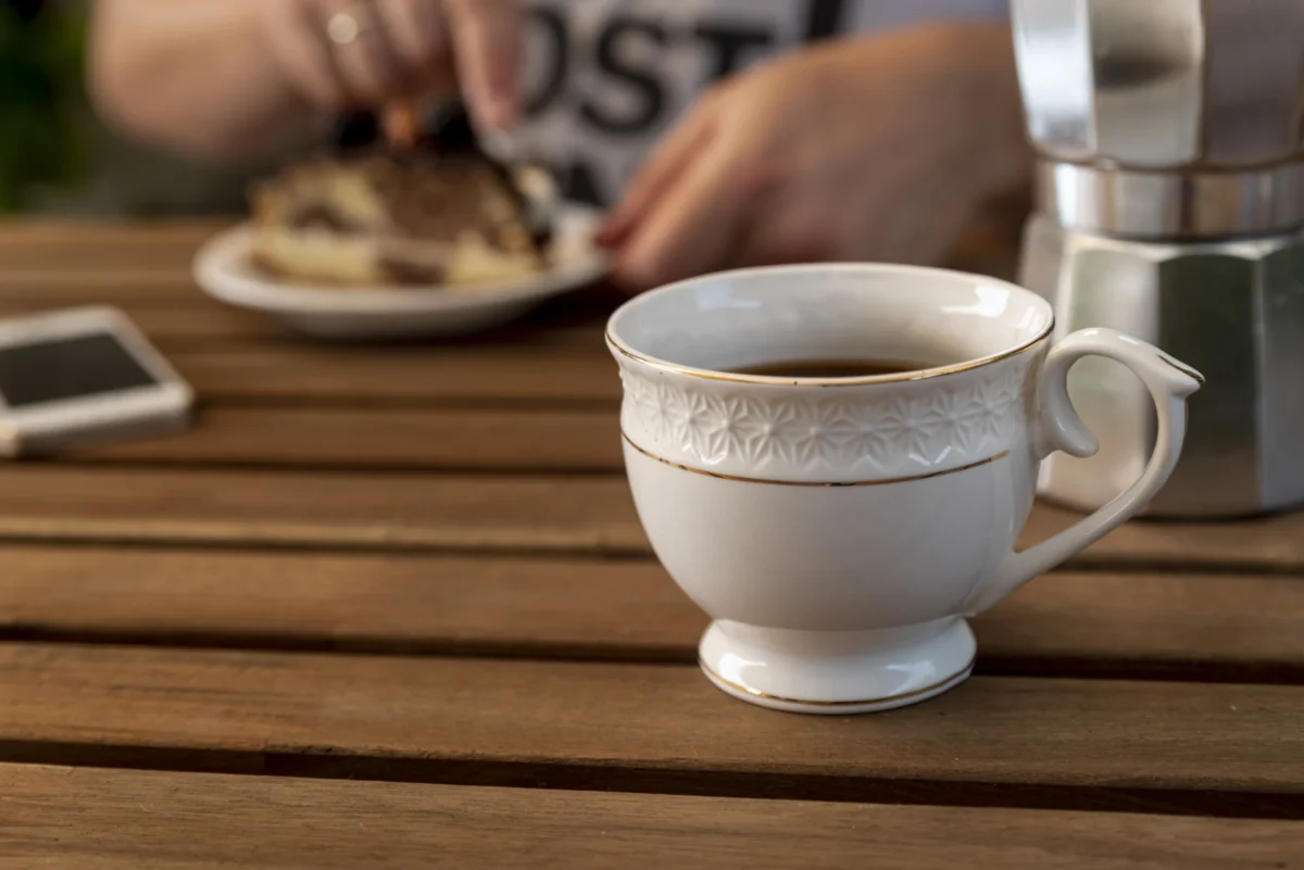 front-view-cup-coffee-wooden-table