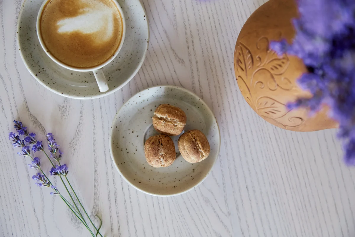 vegan-natural-nuts-sweets-with-no-sugar-cup-cappuccino-wooden-table-cafe-natural-sweets-coffee-break-lavender-decorations