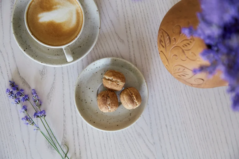 vegan-natural-nuts-sweets-with-no-sugar-cup-cappuccino-wooden-table-cafe-natural-sweets-coffee-break-lavender-decorations